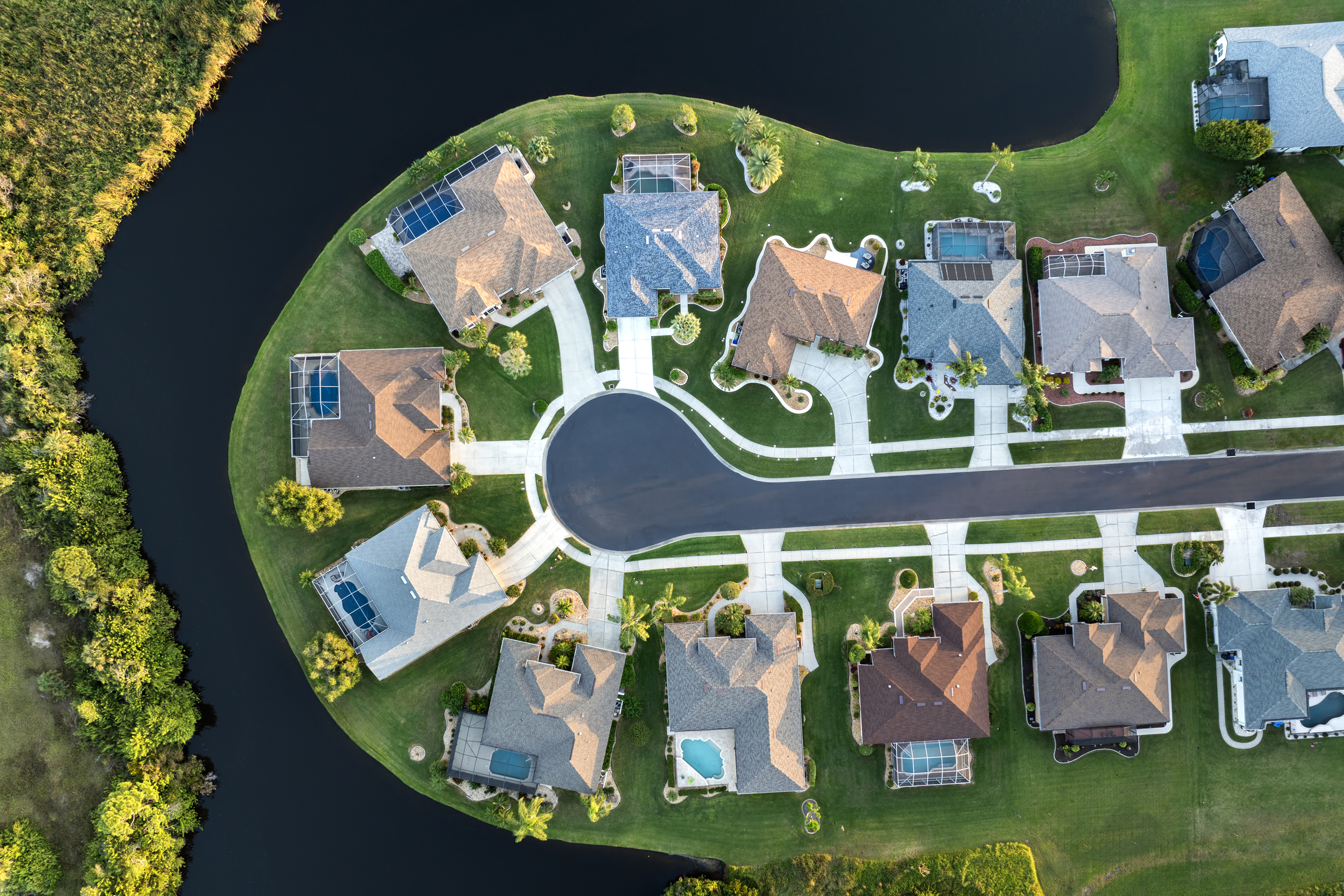 Aerial view of houses in a waterfront community.