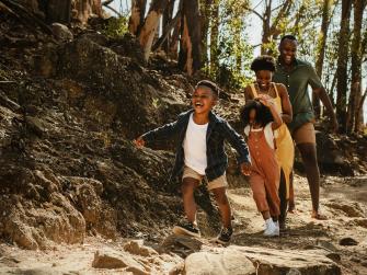 Happy family hiking outdoors.
